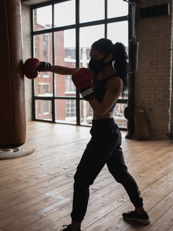 Close-up of a man's determined face during a workout.